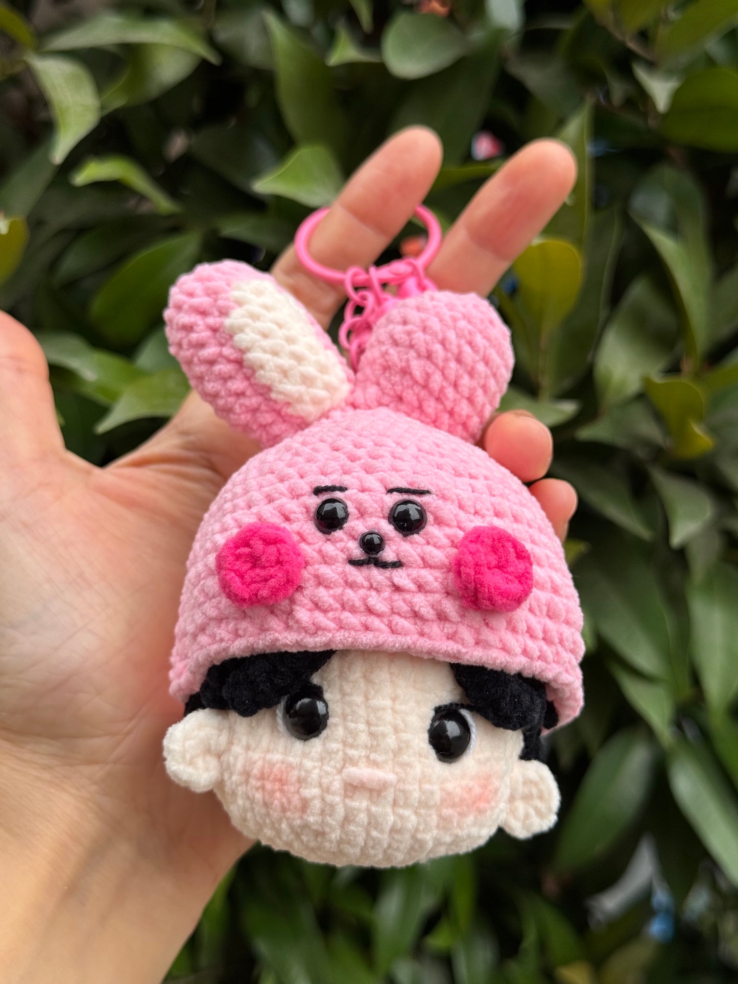 Holding BTS JungKook crochet keychain inspired by BT21 Cooky, a gift for ARMY, BTS fans